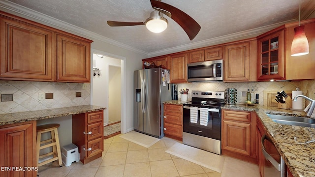 1859 Poplar Hill Rd, Knoxville, TN 37922 - kitchen with stainless steel appliances, a sink, ceiling fan, decorative backsplash, and brown cabinetry