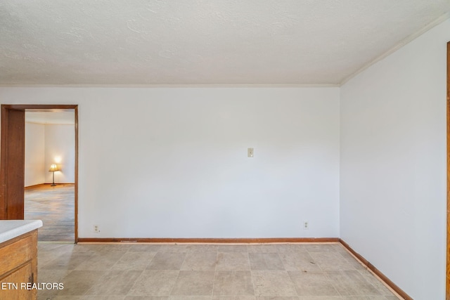 812 W Emerald Ave, Knoxville, TN 37921 - empty room with baseboards, a textured ceiling, and crown molding