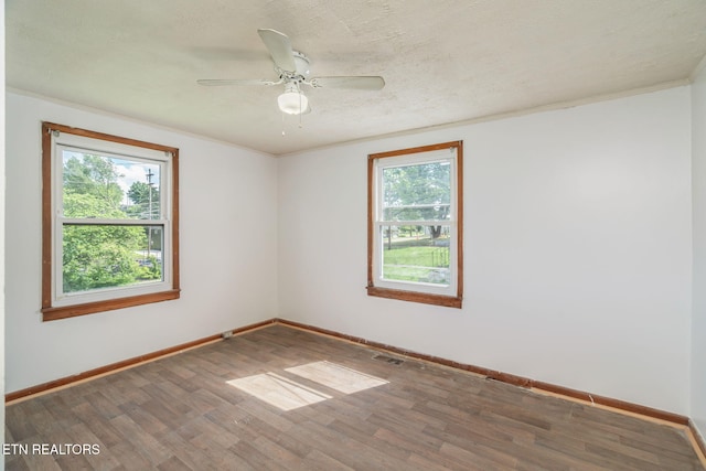 812 W Emerald Ave, Knoxville, TN 37921 - unfurnished room with wood finished floors, baseboards, a ceiling fan, and crown molding