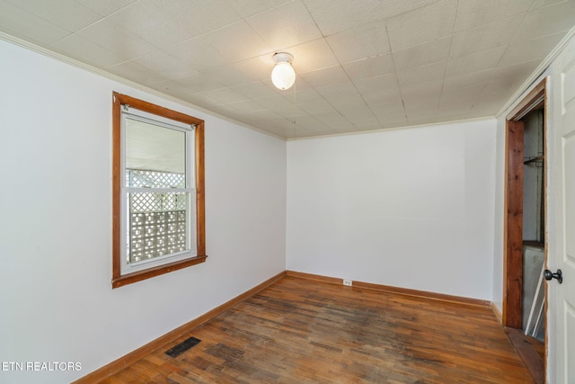 812 W Emerald Ave, Knoxville, TN 37921 - unfurnished room featuring crown molding, hardwood / wood-style flooring, and baseboards