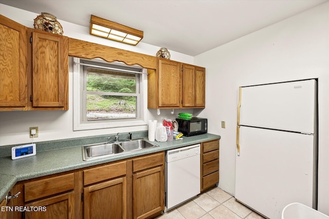 1103 Boles Beaty Rd, Alpine, TN 38543 - kitchen with white appliances, a sink, brown cabinets, and light tile patterned flooring