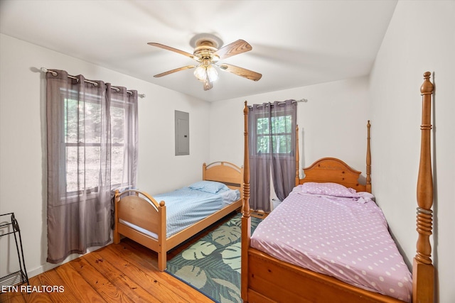 1103 Boles Beaty Rd, Alpine, TN 38543 - bedroom featuring electric panel, light wood-type flooring, and ceiling fan