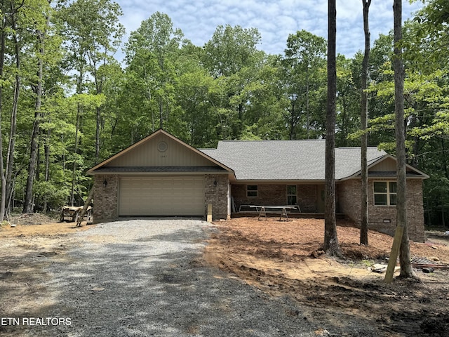 1847 Chinkapin Trl, Monterey, TN 38574 - view of front of property with brick siding, driveway, a garage, and a shingled roof