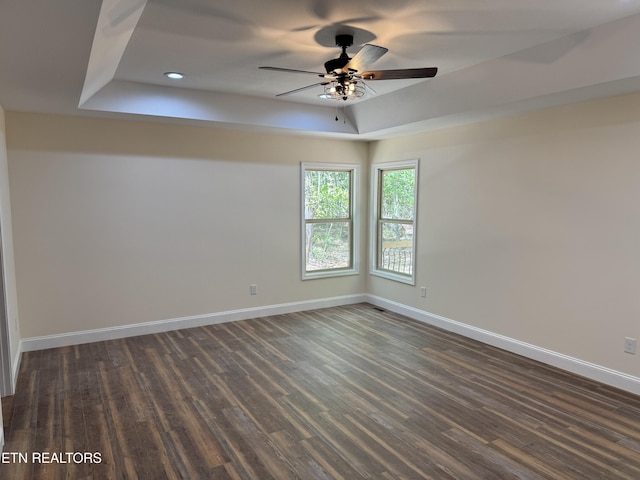 1847 Chinkapin Trl, Monterey, TN 38574 - unfurnished room with a tray ceiling, baseboards, dark wood finished floors, a ceiling fan, and recessed lighting