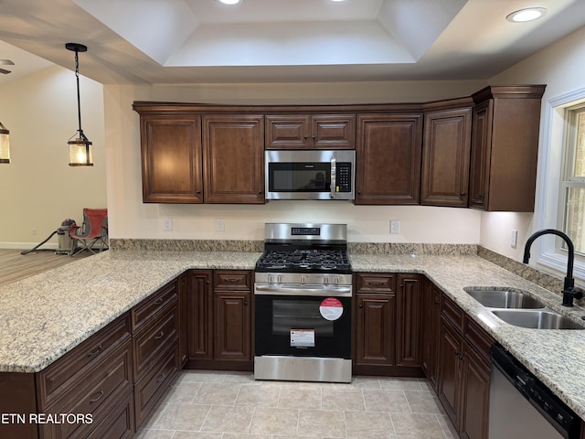 1847 Chinkapin Trl, Monterey, TN 38574 - kitchen with appliances with stainless steel finishes, a sink, a raised ceiling, a peninsula, and dark brown cabinetry