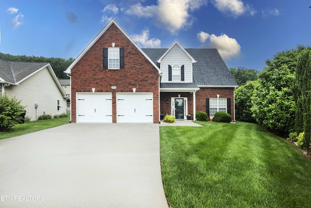 3030 Maple Knot Ln, Knoxville, TN 37931 - traditional-style house featuring brick siding, an attached garage, concrete driveway, and a front lawn