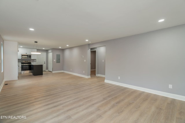 600 N Trinity Ave, Rockwood, TN 37854 - unfurnished living room with recessed lighting, baseboards, light wood-style flooring, and electric panel