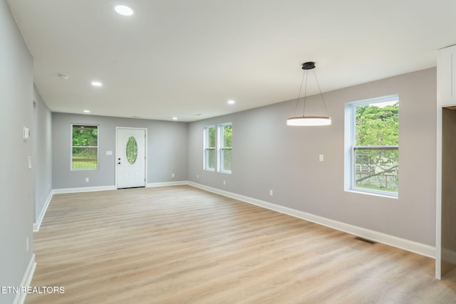 600 N Trinity Ave, Rockwood, TN 37854 - empty room with recessed lighting, baseboards, light wood-type flooring, and healthy amount of natural light