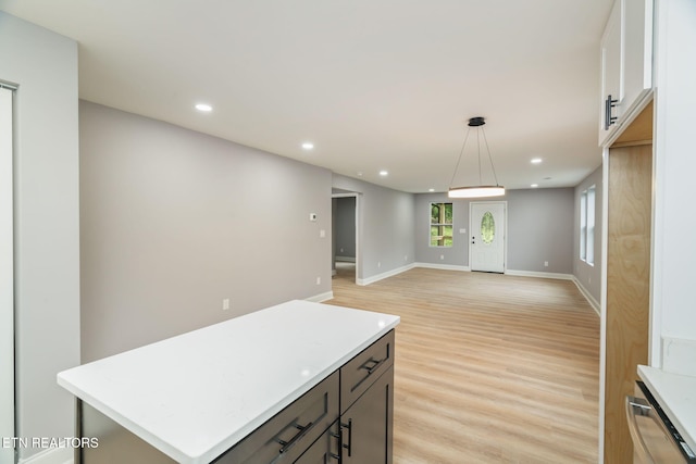 600 N Trinity Ave, Rockwood, TN 37854 - kitchen featuring light wood-type flooring, light countertops, recessed lighting, and decorative light fixtures