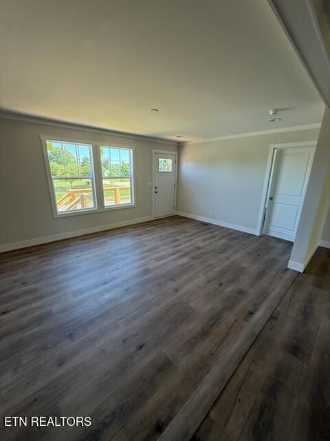 7922 Harmon Rd, Powell, TN 37849 - unfurnished living room with baseboards, dark wood finished floors, and crown molding