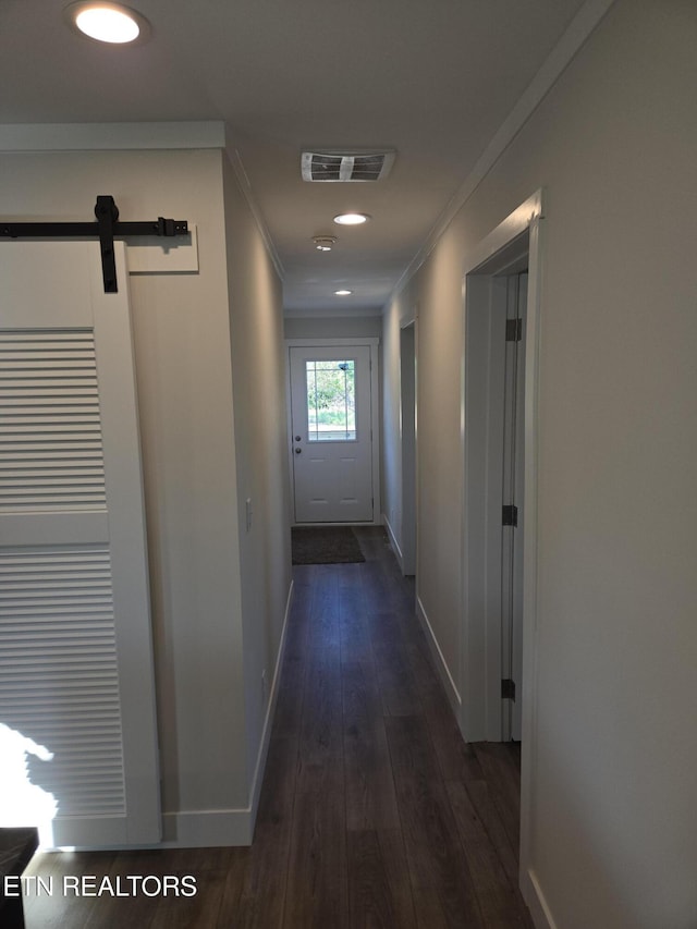 7922 Harmon Rd, Powell, TN 37849 - hall featuring ornamental molding, a barn door, baseboards, dark wood-style flooring, and recessed lighting