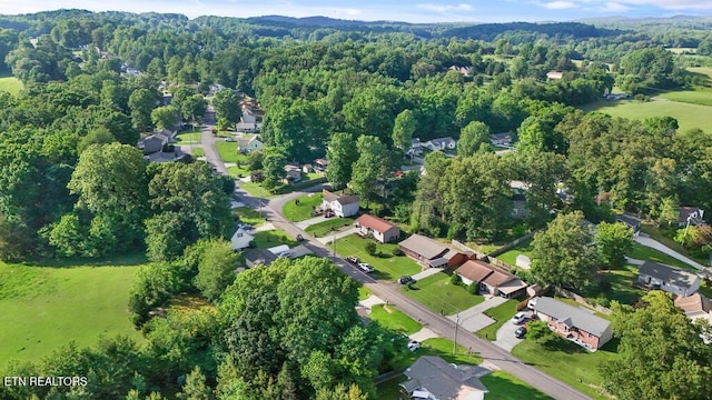 233 Doe Run Blvd, Clinton, TN 37716 - aerial view of property and surrounding area with a heavily wooded area and nearby suburban area