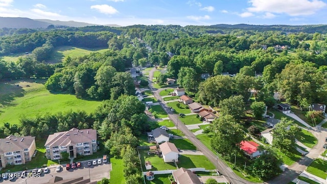 233 Doe Run Blvd, Clinton, TN 37716 - aerial view of property and surrounding area with a heavily wooded area, mountains, and nearby suburban area