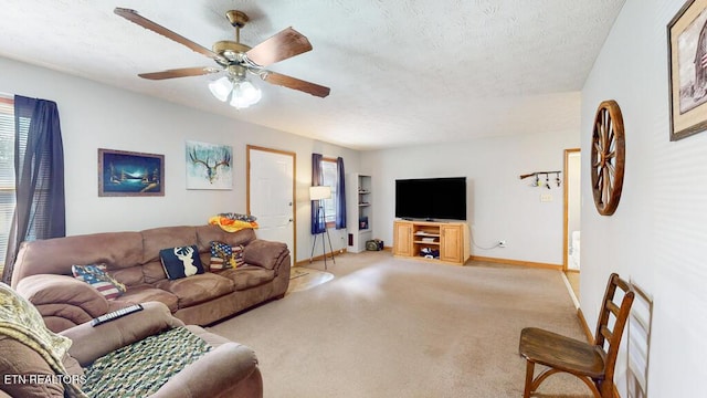 233 Doe Run Blvd, Clinton, TN 37716 - carpeted living area featuring baseboards, a ceiling fan, and a textured ceiling