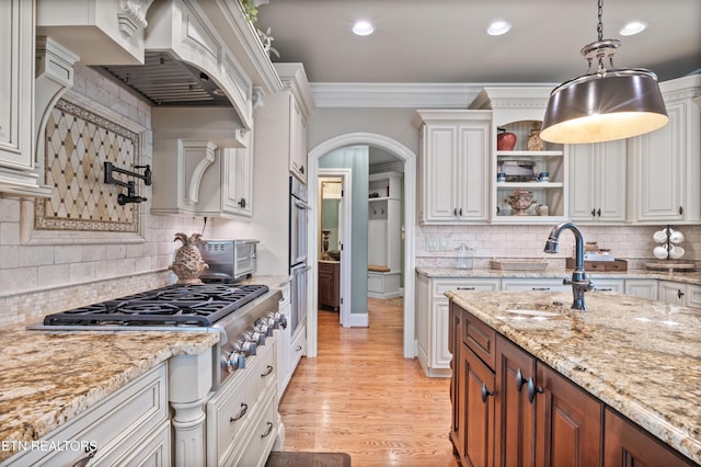 759 Indian Mountain Rd, Jellico, TN 37762 - kitchen featuring crown molding, backsplash, a sink, white cabinets, and light stone counters