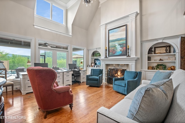 759 Indian Mountain Rd, Jellico, TN 37762 - living room with high vaulted ceiling, a tile fireplace, built in features, a desk, and healthy amount of natural light