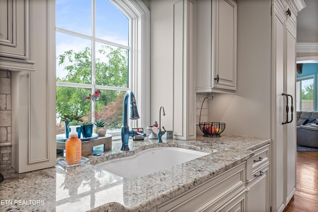 759 Indian Mountain Rd, Jellico, TN 37762 - kitchen featuring a sink and light stone counters