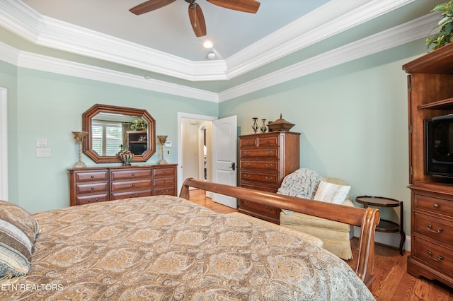 759 Indian Mountain Rd, Jellico, TN 37762 - bedroom featuring wood finished floors, crown molding, a tray ceiling, and a ceiling fan