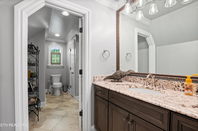 759 Indian Mountain Rd, Jellico, TN 37762 - bathroom with vanity, toilet, ornamental molding, baseboards, and lofted ceiling
