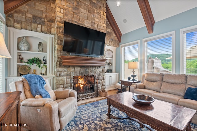 759 Indian Mountain Rd, Jellico, TN 37762 - living room with built in features, beamed ceiling, a fireplace, wood finished floors, and high vaulted ceiling
