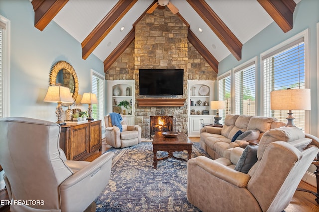 759 Indian Mountain Rd, Jellico, TN 37762 - living room with a fireplace, beam ceiling, wood finished floors, built in features, and high vaulted ceiling