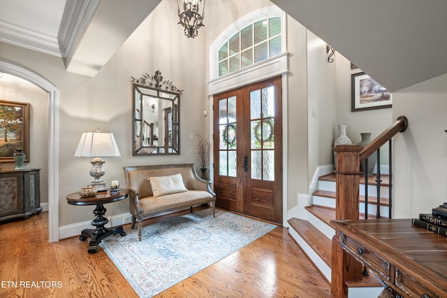 759 Indian Mountain Rd, Jellico, TN 37762 - entryway with french doors, crown molding, wood finished floors, stairway, and baseboards