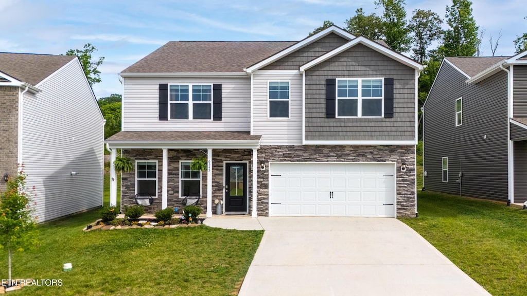 6345 Night Time Dr, Knoxville, TN 37931 - craftsman house featuring stone siding, driveway, a front lawn, and a porch