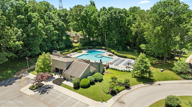 8707 Olde Colony Trl Unit 17, Knoxville, TN 37923 - drone / aerial view of a pool area and a tree filled landscape