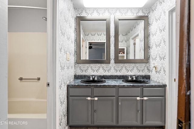 8707 Olde Colony Trl Unit 17, Knoxville, TN 37923 - bathroom with wallpapered walls, double vanity, a ceiling fan, and a tub