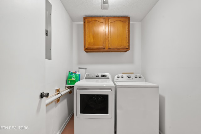 8707 Olde Colony Trl Unit 17, Knoxville, TN 37923 - laundry area with independent washer and dryer, cabinet space, a textured ceiling, baseboards, and tile patterned flooring