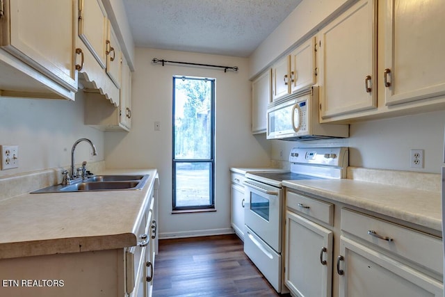 4003 Valley View Dr Unit 6, Knoxville, TN 37917 - kitchen with white appliances, a sink, light countertops, a textured ceiling, and dark wood-style flooring
