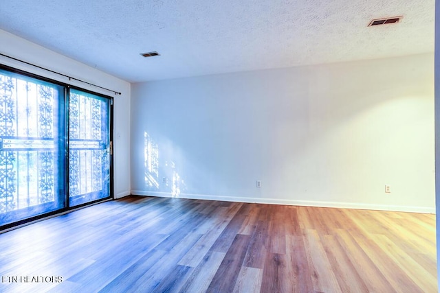 4003 Valley View Dr Unit 6, Knoxville, TN 37917 - unfurnished room with a textured ceiling, wood finished floors, and baseboards