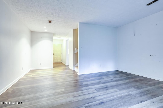 4003 Valley View Dr Unit 6, Knoxville, TN 37917 - empty room with wood finished floors, a textured ceiling, and baseboards