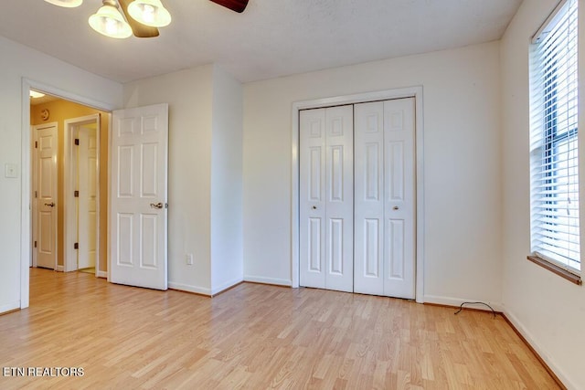 4003 Valley View Dr Unit 6, Knoxville, TN 37917 - unfurnished bedroom with light wood finished floors, baseboards, a closet, and a ceiling fan