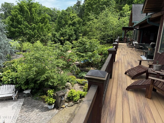 1309 Licklog Hollow Rd, Sevierville, TN 37876 - wooden terrace with a wooded view