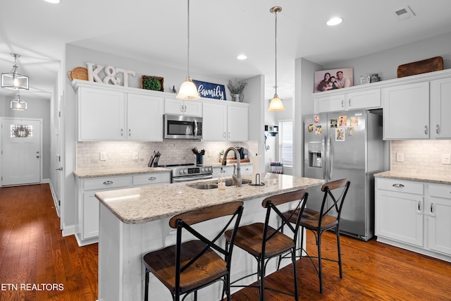 1227 Branch Creek Ln, Maryville, TN 37801 - kitchen featuring stainless steel appliances, a sink, decorative backsplash, white cabinetry, and recessed lighting