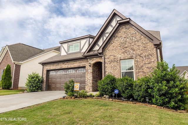 1227 Branch Creek Ln, Maryville, TN 37801 - view of front of property featuring driveway, a front yard, brick siding, and roof with shingles