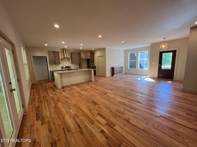 110 Stone Rd, Knoxville, TN 37920 - unfurnished living room with light wood-style floors, recessed lighting, and baseboards