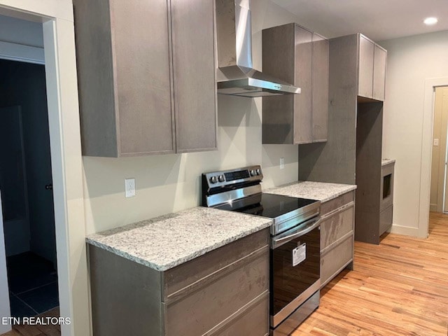 110 Stone Rd, Knoxville, TN 37920 - kitchen featuring wall chimney exhaust hood, electric stove, light wood-type flooring, recessed lighting, and light stone countertops