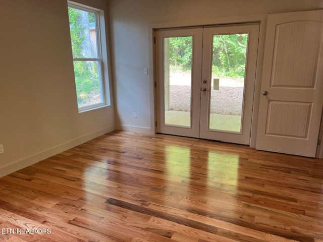 110 Stone Rd, Knoxville, TN 37920 - spare room with french doors, baseboards, and wood finished floors