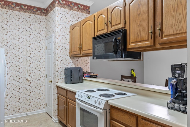 15 Breakers Ct, Clinton, TN 37716 - kitchen featuring white range with electric cooktop, black microwave, light countertops, brown cabinetry, and ornamental molding