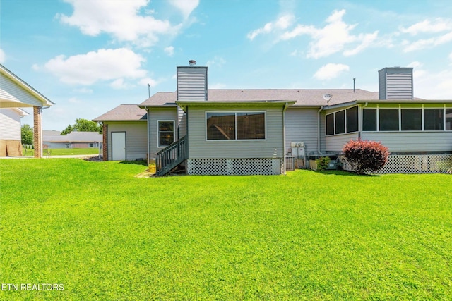 15 Breakers Ct, Clinton, TN 37716 - back of house featuring a chimney, a sunroom, and a yard