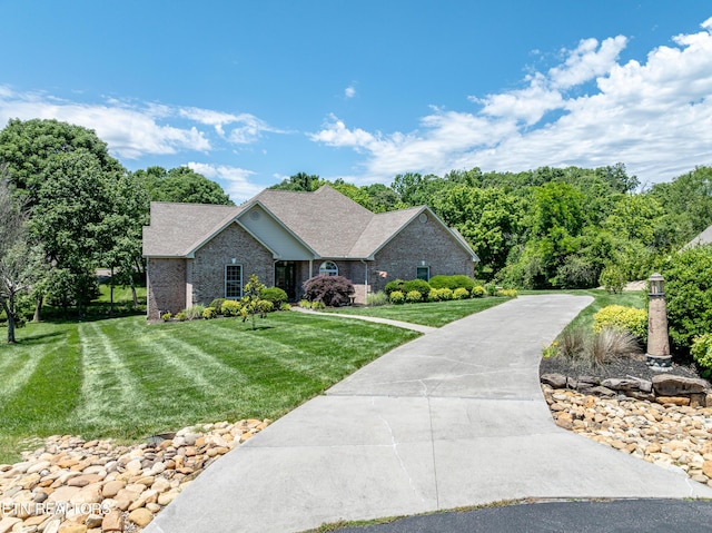 210 Oologila Pl, Loudon, TN 37774 - ranch-style home featuring a front yard, brick siding, and roof with shingles