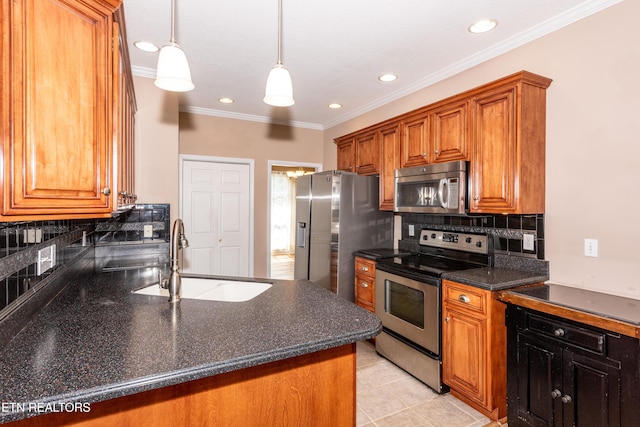210 Oologila Pl, Loudon, TN 37774 - kitchen featuring stainless steel appliances, a sink, brown cabinetry, crown molding, and tasteful backsplash