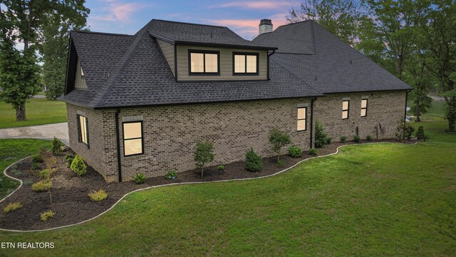 708 Lakeside Ct, Dandridge, TN 37725 - view of side of home featuring a chimney, a lawn, brick siding, and a shingled roof