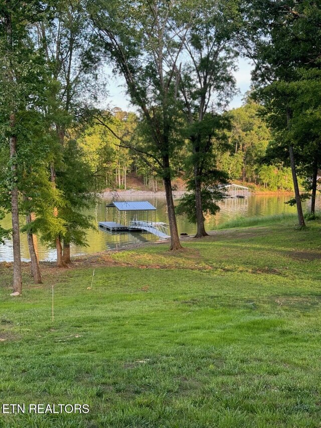 708 Lakeside Ct, Dandridge, TN 37725 - view of grassy yard with a floating dock and a water view