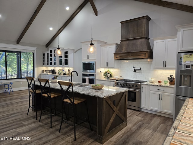 708 Lakeside Ct, Dandridge, TN 37725 - kitchen featuring appliances with stainless steel finishes, a sink, premium range hood, dark wood finished floors, and glass insert cabinets