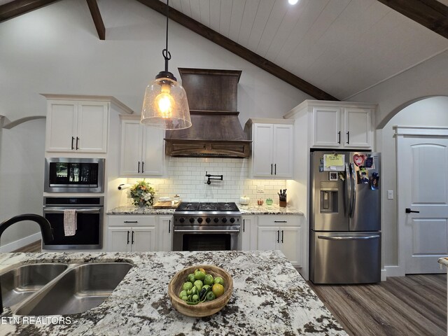 708 Lakeside Ct, Dandridge, TN 37725 - kitchen with appliances with stainless steel finishes, a sink, decorative backsplash, white cabinets, and premium range hood