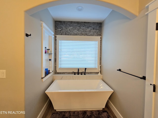 708 Lakeside Ct, Dandridge, TN 37725 - full bathroom with a freestanding bath, baseboards, and wood finished floors