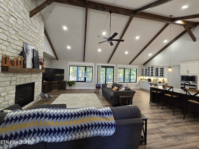 708 Lakeside Ct, Dandridge, TN 37725 - living area featuring high vaulted ceiling, ceiling fan, a fireplace, beam ceiling, and wood finished floors